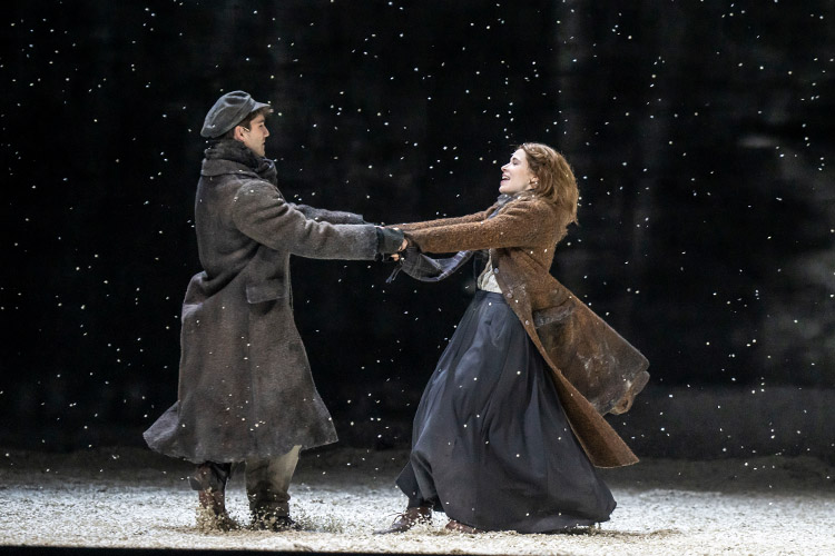 Perchik and Hodel holding hands, spinning, in the snow.